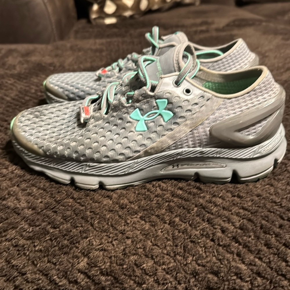 Women’s UA CHARGED shoes size 8.5. Worn but have a lot of life in them!